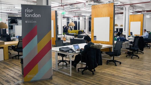 Tech entrepreneurs work at the Rise London accelerator in London.