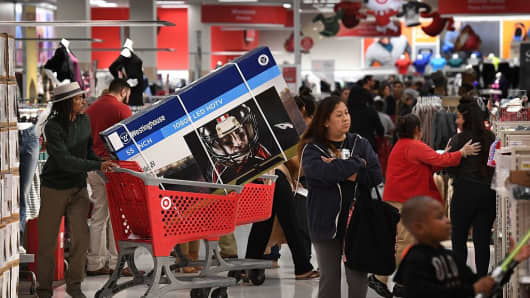 Thanksgiving Day shoppers push loaded up carts during the 'Black Friday' sales at a Target store in Culver City, California on November 24, 2016.