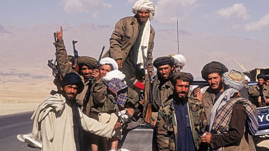 Taliban fighters with a vehicle on highways in Afghanistan.