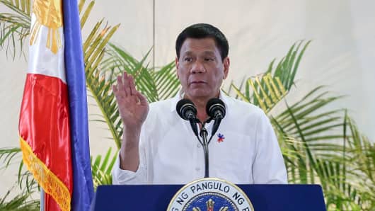 Philippine President Rodrigo Duterte gestures during a speech.