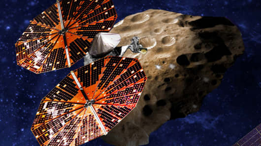 An artist’s conception of the Lucy spacecraft flying by the Trojan Eurybates – one of the six diverse and scientifically important Trojans to be studied.
