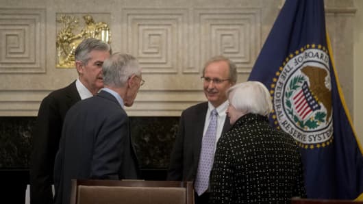 Janet Yellen, chair of the U.S. Federal Reserve, from right. Scott Alvarez, general council with the U.S. Federal Reserve, Stanley Fischer, vice chairman of the U.S. Federal Reserve, and Jerome Powell, governor of the U.S. Federal Reserve, talk after a meeting of the Board of Governors of the Federal Reserve in Washington, D.C., U.S., on Monday, Nov. 30, 2015.