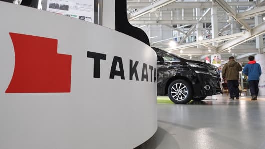 The logo of the Japanese auto parts maker Takata is displayed at a car showroom in Tokyo on January 13, 2017.