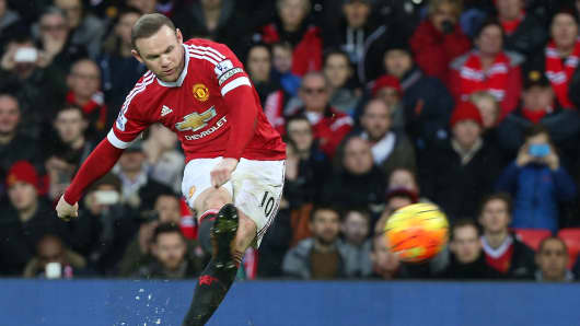 Wayne Rooney of Manchester United in action with Ashley Williams of Swansea City during the Barclays Premier League match between Manchester United and Swansea City at Old Trafford on January 2, 2016 in Manchester, England.
