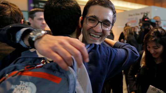 Behnam Partopour, a Worcester Polytechnic Institute (WPI) student from Iran, is greeted by friends at Logan Airport after he cleared U.S. customs and immigration on an F1 student visa in Boston, Massachusetts. Partopour was originally turned away from a flight to the U.S. following President Donald Trump's executive order travel ban.
