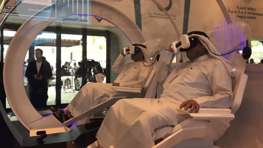 Visitors try out the Mars 2117 virtual reality experience at the World Government Summit in Dubai on February 2, 2017.