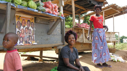 Women sell vegetables on the road to Murchison Falls near Masindi, Uganda.