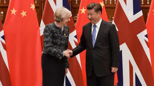 Chinese President Xi Jinping (R) shakes hand with British Prime Minister Theresa May (L) before their meeting at the West Lake State House on September 5, 2016 in Hangzhou, China.