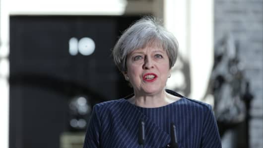 British Prime Minister Theresa May speaks to the media outside 10 Downing Street in central London on April 18, 2017. British Prime Minister Theresa May called today for an early general election on June 8 in a surprise announcement as Britain prepares for delicate negotiations on leaving the European Union.