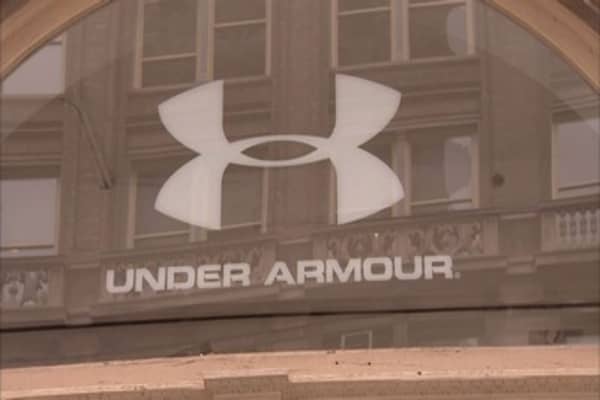 Under Armour shares surge on its first-ever loss