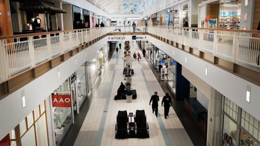 People walk through a nearly empty shopping mall on March 28, 2017 in Waterbury, Connecticut. As consumers buying habits change and more people prefer to spend money on technology and experiences like vacations over apparel, shopping malls across the country are suffering.