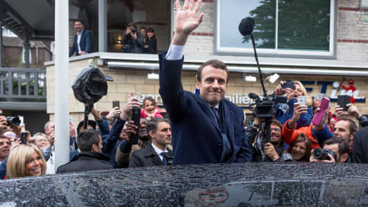 Founder and leader of the political En Marche! movement and presidential candidate Emmanuel Macron (C) waves after voting in Le Touquet-Paris-Plage, France on May 7, 2017.