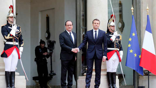 Image result for France's Macron pledges to overcome division in society