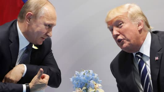US President Donald Trump (R) and Russia's President Vladimir Putin speaks during their meeting on the sidelines of the G20 Summit in Hamburg, Germany, on July 7, 2017