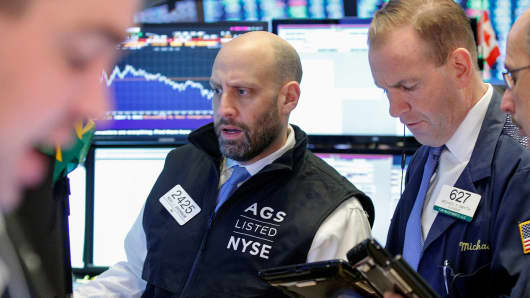 Traders work on the floor of the New York Stock Exchange (NYSE) in New York.