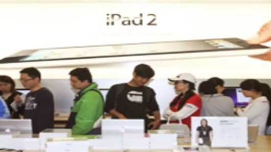 People queue to buy iPad 2 at an Apple store on May 6, 2011 in Shanghai, China.