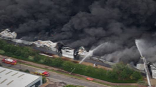 An aerial view of the Sony distribution center engulfed in fire on the 9th August, 2011 in London. Widespread looting, arson and clashes with police continued for a third day in parts of the capital, as well as in Liverpool, Birmingham and Bristol, as the disruption carries into a fourth night.