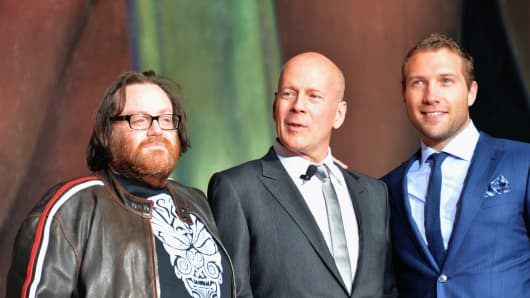 Director John Moore, actor Bruce Willis and actor Jai Courtney attend the dedication and unveiling of a new soundstage mural celebrating 25 years of 'Die Hard' at Fox Studio Lot.