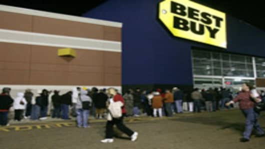 Shoppers rush to get in line outside of the Best Buy early Friday, Nov. 24, 2006, in Jackson, Miss., to take advantage of the Black Friday bargains. (AP Photo/Rogelio V. Solis)