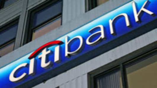 The Citibank logo is shown on a branch office Wednesday, April 11, 2007 in New York. Citigroup Inc., which includes Citibank, announced Wednesday that it will eliminate about 17,000 jobs as part of a companywide restructuring to reduce costs and improve profits. (AP Photo/Mark Lennihan)