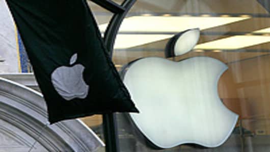 A flag showing the Apple Computer logo flies outside the Apple shop in Regent Street, London