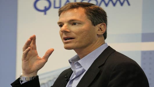 Paul Jacobs, CEO of QUALCOMM, gestures as he speaks on QUALCOMM'S mobile multimedia technology during a news conference at the Cellular Communications and Internet Association convention in Las Vegas, Wednesday, April 5, 2006. (AP Photo/Jae C. Hong)