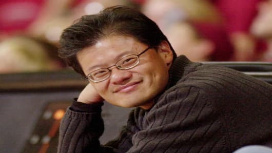 Yahoo! co-founder Jerry Yang smiles as he watches the Stanford basketball game against Washington State, Thursday, March 3, 2005 in Stanford, Calif. Yahoo! celebrated their 10th anniversary this week. David Filo and Yang founded Yahoo! as doctoral students at Stanford. (AP Photo/Paul Sakuma)