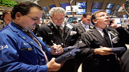 Traders work on the floor of the New York Stock Exchange.