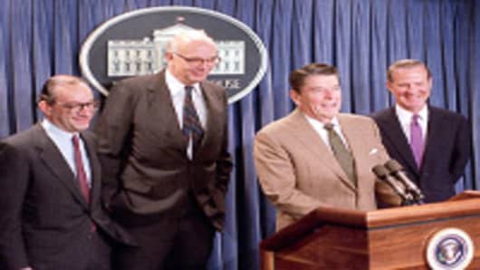 U.S. President Ronald Reagan announces the appointment of Alan Greenspan, left, as his choice to replace Paul Volcker, center, as chairman of the Federal Reserve Board at a White House briefing, Tuesday morning on June 2, 1987. The man at right is Secretary of Treasury James A. Baker III.