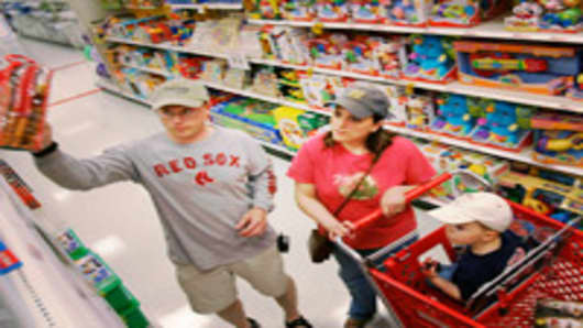 Shoppers in a toy aisle at a Target store.
