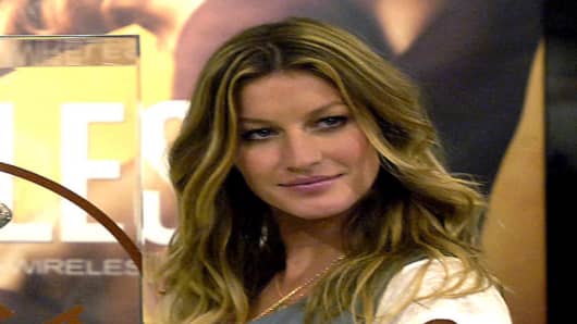 Supermodel Gisele Bundchen appears at a photo call to launch the new "Body By Victoria IPEX Wireless" bra at a Victoria's Secret store Wednesday, March 1, 2006 in New York.  (AP Photo/Jason DeCrow)