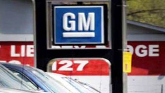 GM auto dealership with sign.