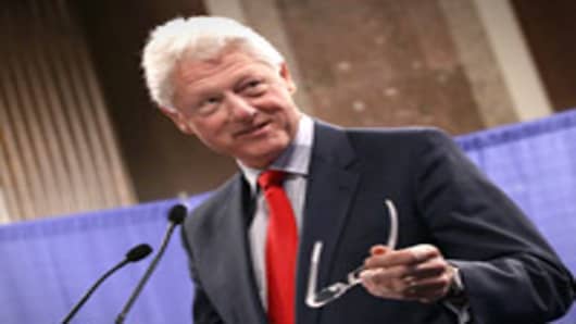 Former U.S. President Bill Clinton seen speaking during the inaugural Rural Summit in Washington, DC