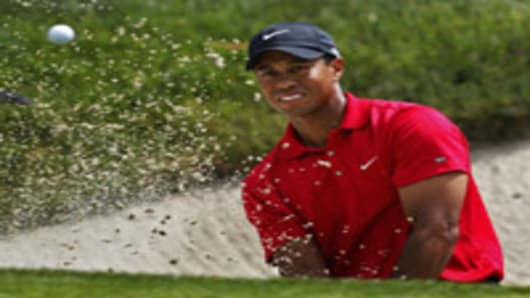 Tiger Woods hits out of a bunker on the eighth green during a playoff round at the US Open golf tournament, Torrey Pines Golf, San Diego, California.