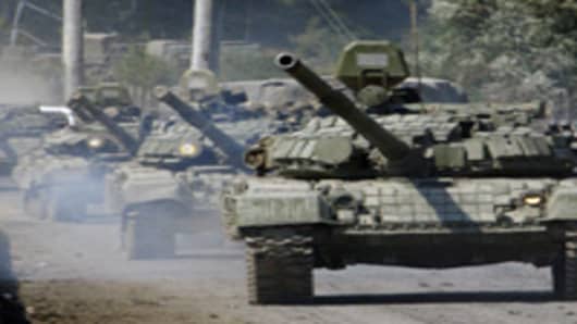 A column of Russian tanks rolls near the town of Dzhava in the separatist Georgian province of South Ossetia.