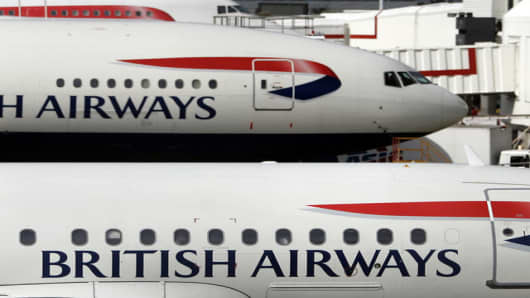 British Airways planes parked at Heathrow Airport in London, Wednesday Aug. 1, 2007. A British regulator on Wednesday fined British Airways 121.5 million pounds (US$ 246 million; euro 180 million) after the airline admitted colluding with a rival over surcharges on long-haul flights. BA said it accepted the fine from the Office of Fair Trading and expected to be hit with another penalty from the U.S. Department of Justice later in the day. (AP Photo/Kirsty Wigglesworth)