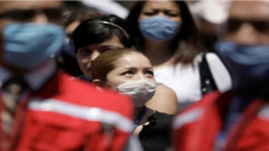 People wearing surgical masks to prevent swine flu