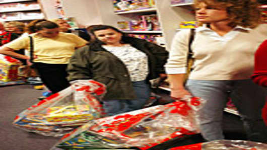 Customers wait in line to pay for their items on Black Friday at KB Toys in King of Prussia, Pennsylvania.