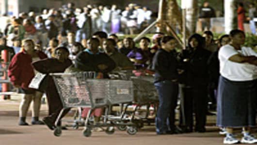 People stand in front of a Walmart store before the doors open at 5am on 'Black Friday' in Miami, Florida.