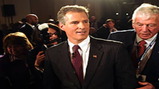 Republican State Sen. Scott Brown exits the debate hall following a senatorial debate at the University of Massachusetts January 11, 2010 in Boston.