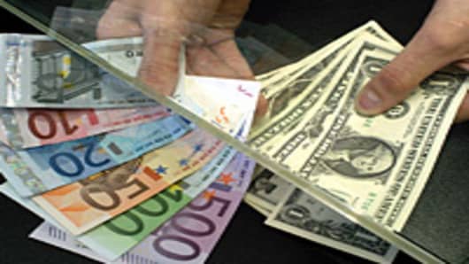 Euro bills and U.S. dollars being exchanged