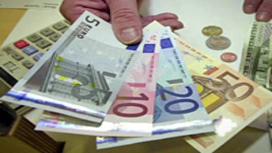 Euro bills in hand