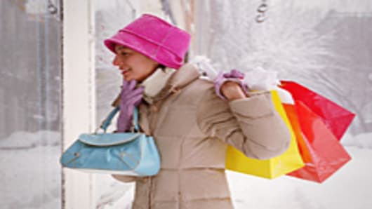 Woman window shopping on a snowy street