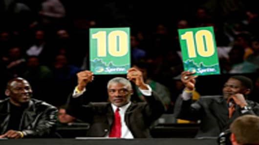 Judges Michael Jordan, Julius Erving and Dominique Wilkins hold up the scores for the winning dunk by Gerald Green of the Boston Celtics in the Sprite Slam Dunk Competition during NBA All-Star Weekend in Las Vegas, Nevada.