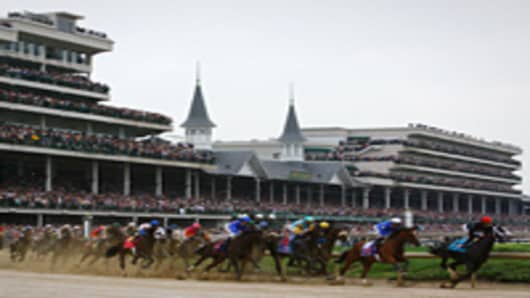 The field rounds turn one during the 135th running of the Kentucky Derby on May 2, 2009 at Churchill Downs in Louisville, Kentucky.