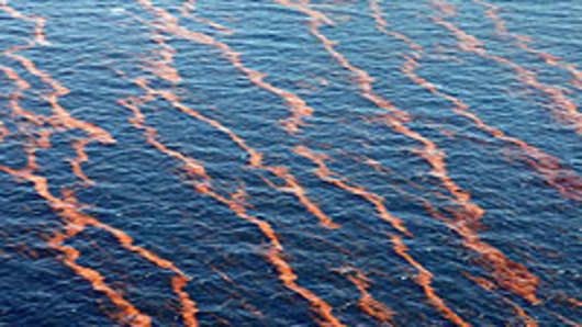Weathered oil collects on surface of water after explosion and collapse of the Deepwater Horizon oil rig, Gulf of Mexico off Louisiana.