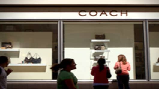 Shoppers look at handbags at a Coach store in Pasadena, California.