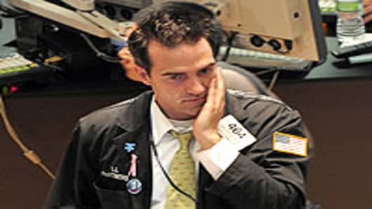 A concerned trader on the floor of the New York Stock Exchange.