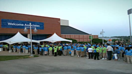 Employees line up for a Walmart meeting.