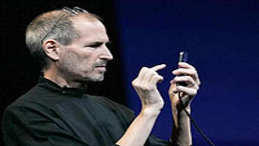 Apple CEO Steve Jobs demonstrates the new iPhone 4.